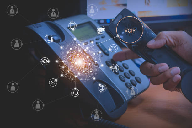Hand of man using voip phone